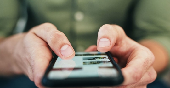 person using social media on phone